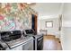 Laundry room featuring floral wallpaper, modern washer and dryer, and a window at 8230 Linda Leigh Ln, Indianapolis, IN 46217