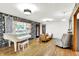 Spacious living room featuring hardwood floors, piano, and an open layout at 8230 Linda Leigh Ln, Indianapolis, IN 46217