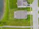 An aerial view of a home showcasing a patio, a lawn, and a pond nearby at 8238 Crackling Ln, Indianapolis, IN 46259