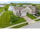 Aerial view of a two-story home with a spacious yard and a serene lake nearby at 8238 Crackling Ln, Indianapolis, IN 46259