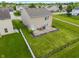 Aerial view of a home boasting a large, fenced backyard with a patio for relaxation and entertainment at 8238 Crackling Ln, Indianapolis, IN 46259