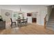 Dining room features hardwood floors, chandelier, and view of backyard pond at 8238 Crackling Ln, Indianapolis, IN 46259
