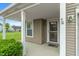 Welcoming front porch with classic columns and a neatly trimmed shrub at 8238 Crackling Ln, Indianapolis, IN 46259