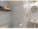 Half bathroom with a sink, mirror, and toilet at 8238 Crackling Ln, Indianapolis, IN 46259
