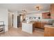 Spacious kitchen featuring wood cabinets, stainless steel refrigerator, and center island at 8238 Crackling Ln, Indianapolis, IN 46259