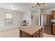 Bright kitchen features an island with a work space and stainless steel appliances at 8238 Crackling Ln, Indianapolis, IN 46259