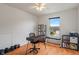 Home office with modern desk, ample natural light, and views of the neighborhood outside the window at 8238 Crackling Ln, Indianapolis, IN 46259