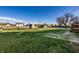 Expansive backyard featuring a storage shed, a large, open grassy area, and a deck at 8510 E Mcgregor Rd, Indianapolis, IN 46259