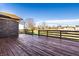 Spacious wooden deck offering ample room for outdoor seating and entertaining with fenced backyard at 8510 E Mcgregor Rd, Indianapolis, IN 46259