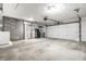Spacious garage featuring an open layout, block wall, and convenient access for parking and storage at 8510 E Mcgregor Rd, Indianapolis, IN 46259