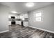 Updated kitchen boasts white cabinets, gray countertops, and stainless steel appliances at 8510 E Mcgregor Rd, Indianapolis, IN 46259