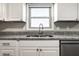 Close-up of a kitchen sink and counter, with stainless steel appliances at 8510 E Mcgregor Rd, Indianapolis, IN 46259