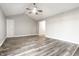 Spacious living room features vaulted ceilings, gray walls and vinyl flooring at 8510 E Mcgregor Rd, Indianapolis, IN 46259