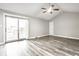 Light-filled living room features sliding glass doors to the backyard deck at 8510 E Mcgregor Rd, Indianapolis, IN 46259