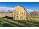 Exterior view of a shed in backyard with a neatly kept fenced backyard at 8510 E Mcgregor Rd, Indianapolis, IN 46259