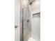 This bathroom features a tiled shower with a glass door and decorative tile accents at 8510 E Mcgregor Rd, Indianapolis, IN 46259