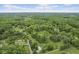Expansive aerial view of a property surrounded by lush greenery and mature trees at 8513 S 575 W, Morgantown, IN 46160
