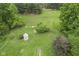 Aerial view of the lush, green backyard featuring a gazebo, mature trees, and manicured lawn at 8513 S 575 W, Morgantown, IN 46160