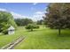 Expansive backyard with gazebo, stone planter and mature trees creates a serene outdoor retreat at 8513 S 575 W, Morgantown, IN 46160