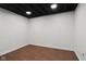Finished basement area with a dark painted ceiling and vinyl flooring at 8513 S 575 W, Morgantown, IN 46160