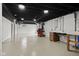 Unfinished basement area with white walls, black ceiling, and concrete floors at 8513 S 575 W, Morgantown, IN 46160