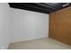 Unfinished basement featuring painted walls and floor, perfect for storage and workshop at 8513 S 575 W, Morgantown, IN 46160