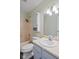 Bright bathroom featuring a shower over tub combination, large vanity, and built-in storage at 8513 S 575 W, Morgantown, IN 46160
