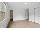 Bright, spacious bedroom with wood-look flooring, natural light, and closet space at 8513 S 575 W, Morgantown, IN 46160