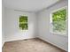 This bedroom features neutral walls, window views, and laminate floors at 8513 S 575 W, Morgantown, IN 46160