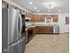 Spacious kitchen features stainless steel appliances, wood cabinetry and wood-look flooring at 8513 S 575 W, Morgantown, IN 46160