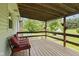 Cozy covered porch with outdoor seating, decorative lighting, and gazebo in the landscaped yard at 8513 S 575 W, Morgantown, IN 46160