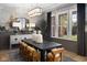 Elegant dining room with stylish decor, large windows, and designer lighting fixture at 9602 Fall Creek Rd, Indianapolis, IN 46256