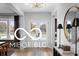 Welcoming foyer with a stylish console table, a statement mirror, and double doors offering an elegant entrance at 9602 Fall Creek Rd, Indianapolis, IN 46256