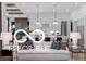 Open-concept living room with view of kitchen, featuring modern furnishings and ample natural light at 9602 Fall Creek Rd, Indianapolis, IN 46256