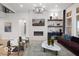 Elegant living room with a modern fireplace, stylish decor, and expansive windows offering natural light at 9602 Fall Creek Rd, Indianapolis, IN 46256