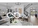 Bright and airy living room with staircase, hardwood floors, and modern decor at 9602 Fall Creek Rd, Indianapolis, IN 46256
