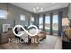 Spacious main bedroom with tall ceilings, many windows, and elegant modern lighting at 9602 Fall Creek Rd, Indianapolis, IN 46256