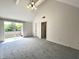 Bright bedroom with vaulted ceiling offers slider access to a private outdoor balcony at 9655 Cedar Cove Ln, Indianapolis, IN 46250