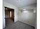 Bedroom features gray carpet, transom window over the partial wall, and open doorway at 9655 Cedar Cove Ln, Indianapolis, IN 46250
