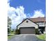 Charming home exterior featuring an attached garage, well-maintained landscaping, and beautiful curb appeal in a desirable community at 9655 Cedar Cove Ln, Indianapolis, IN 46250