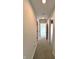 Neutral hallway with multiple doorways leading to various rooms, carpeted floors, and recessed lighting at 9655 Cedar Cove Ln, Indianapolis, IN 46250