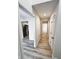 Bright hallway with new hardwood floors and fresh white walls leading to various rooms at 9655 Cedar Cove Ln, Indianapolis, IN 46250