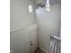Landing area showcasing a white door, round window and a pendant light fixture at 9655 Cedar Cove Ln, Indianapolis, IN 46250