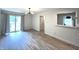 Open living room featuring sliding glass doors and light hardwood flooring at 9655 Cedar Cove Ln, Indianapolis, IN 46250