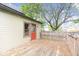 Charming back porch with weathered wood, great for enjoying the outdoors and surrounded by mature trees at 989 Woodruff Pl E Dr, Indianapolis, IN 46201