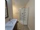 Clean bathroom featuring a white vanity and a glass-enclosed shower at 989 Woodruff Pl E Dr, Indianapolis, IN 46201
