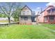 Charming two-story home with brick accents and a welcoming front porch at 989 Woodruff Pl E Dr, Indianapolis, IN 46201