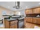 Modern kitchen featuring stainless steel appliances and wood cabinets at 989 Woodruff Pl E Dr, Indianapolis, IN 46201