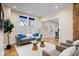 Cozy living room with hardwood floors, neutral colors, and plenty of seating at 989 Woodruff Pl E Dr, Indianapolis, IN 46201