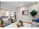 Comfortable living room with neutral decor, hardwood floors, and a stylish coffee table at 989 Woodruff Pl E Dr, Indianapolis, IN 46201